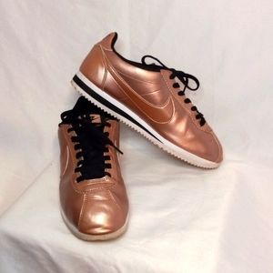 Nike Cortez rose gold and black sneakers
